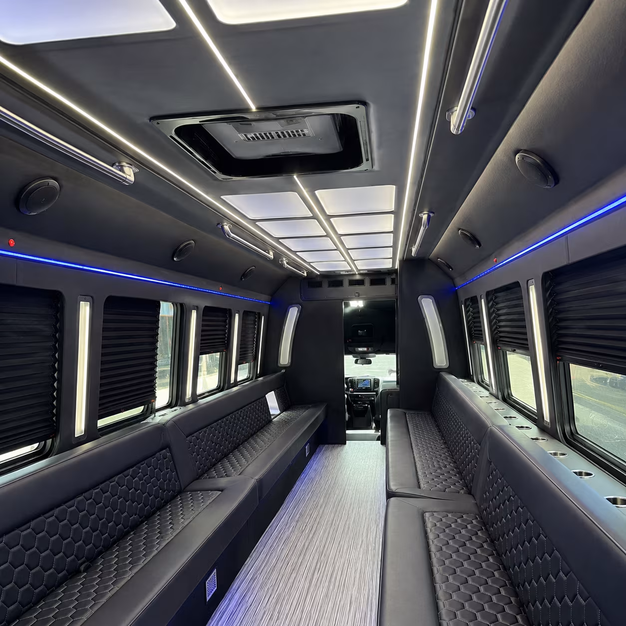Group beside a Mercedes Sprinter limo in Denver