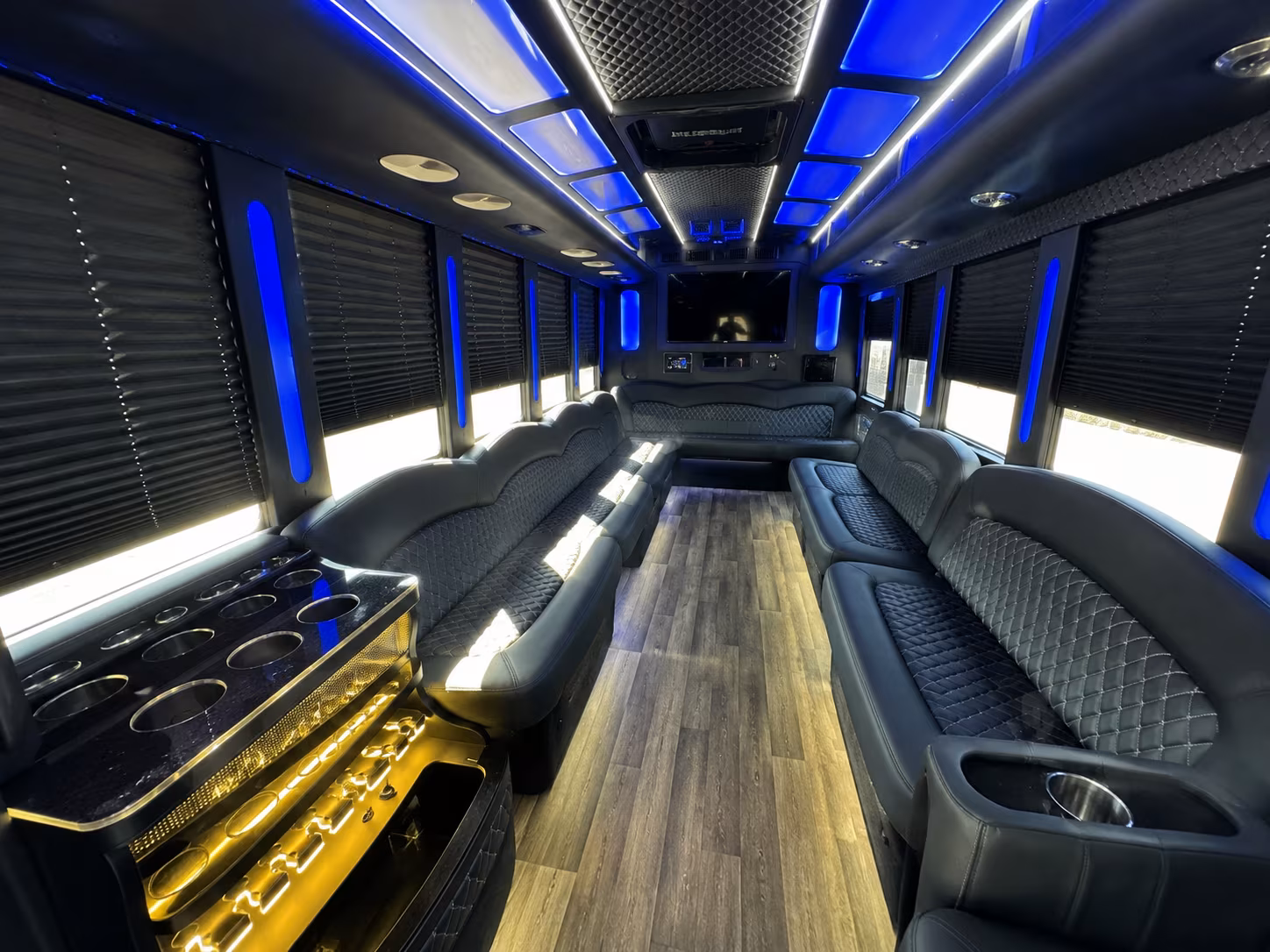 Wedding guests seated inside a party bus serving Denver